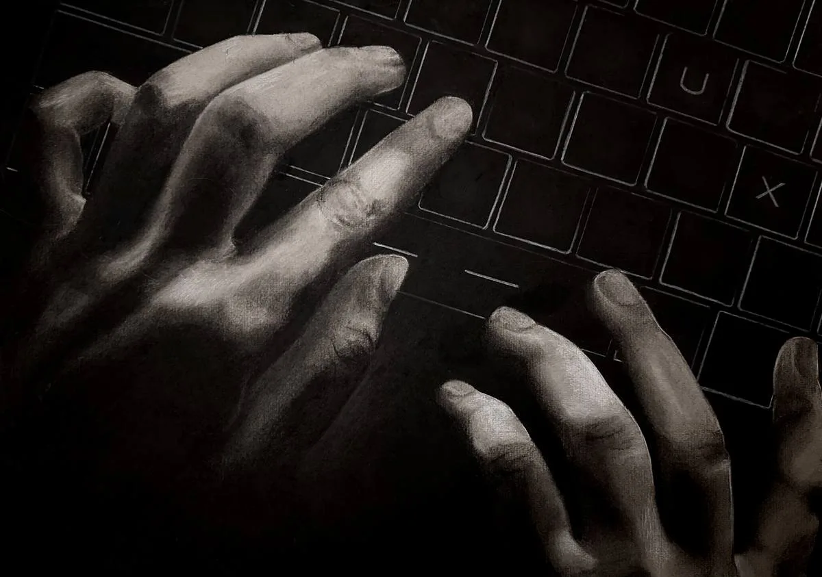 Charcoal drawing of hands on a keyboard